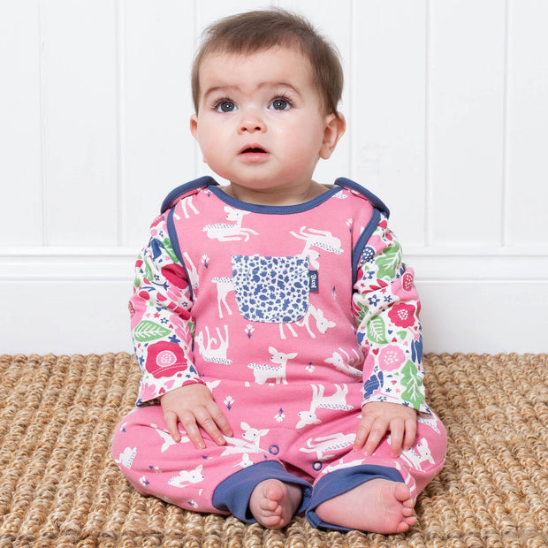 Baby girl in little deer dungarees