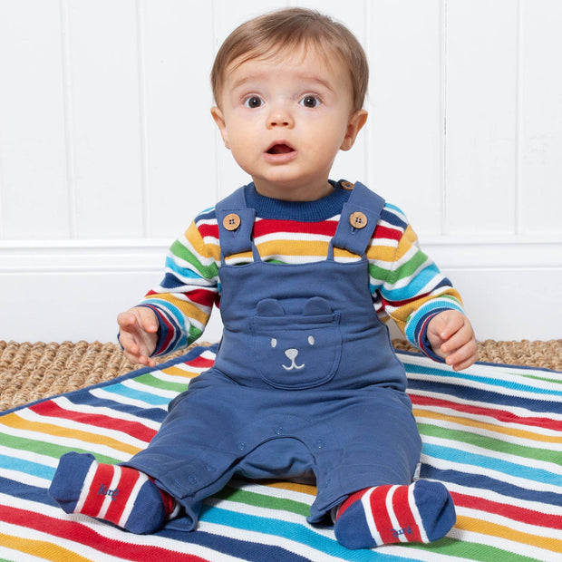 Baby in teddy dungarees