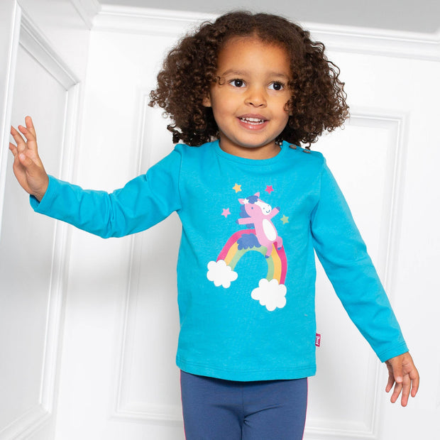 Girl in rainbow pony t-shirt