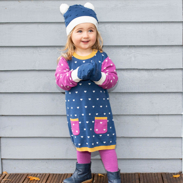 Girl in little heart knit dress
