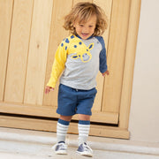 Boy in sport stripe socks