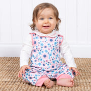 Baby girl in sea breeze dungarees