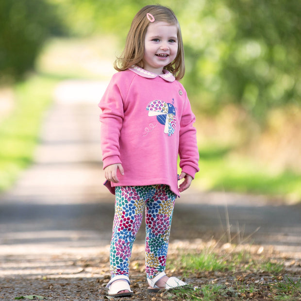 Girl in ladybird sweatshirt