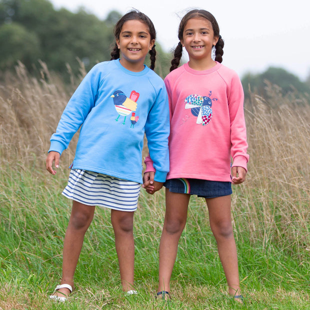 Girl in ladybird sweatshirt