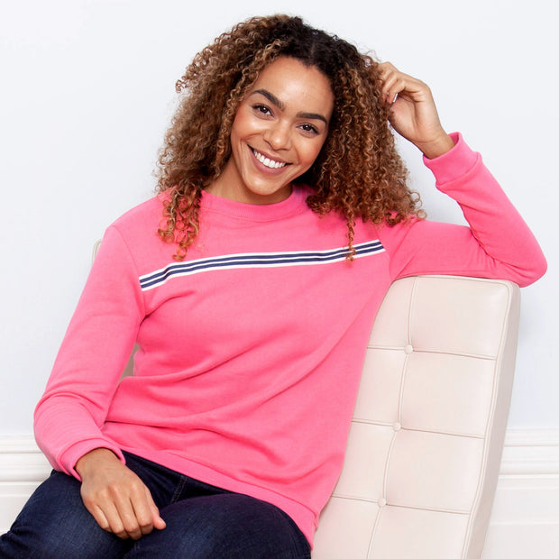 Woman in whitecliff sweatshirt pink