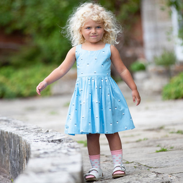 Girl in little boats sundress