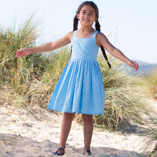 Girl in little boats sundress