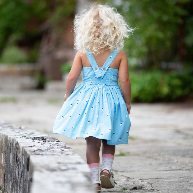 Girl in little boats sundress