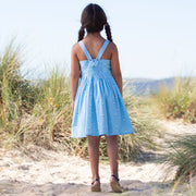 Girl in little boats sundress