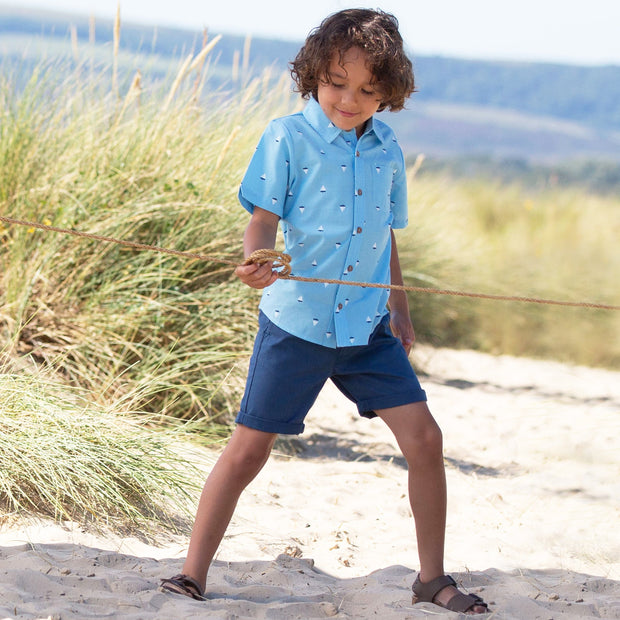 Boy in little boats shirt