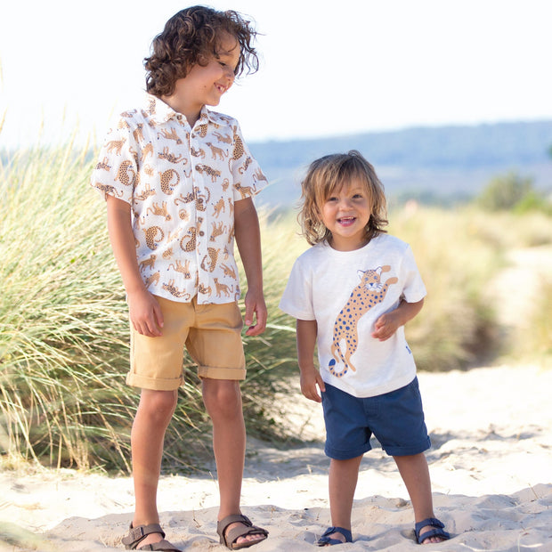 Boy in big cat t-shirt