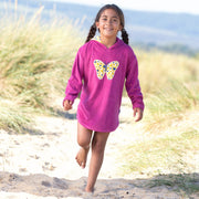 Girl in butterfly beach cover-up