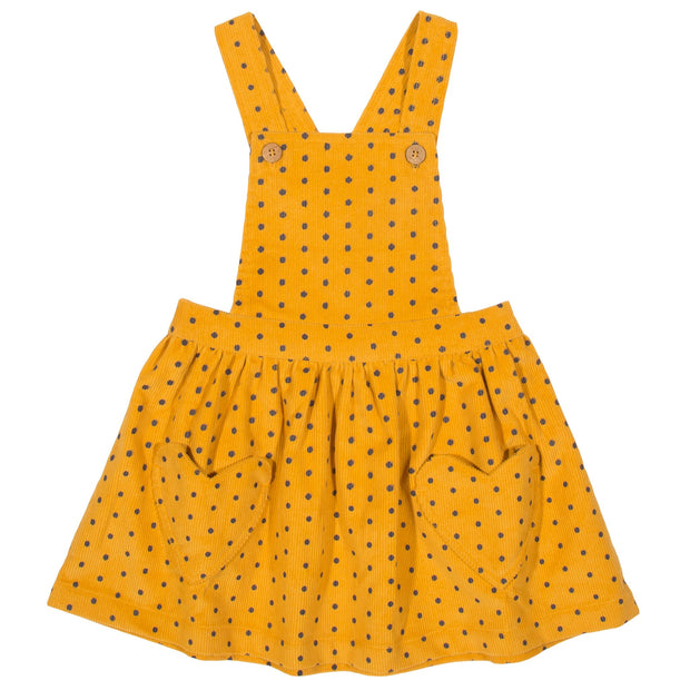 Girl in polka heart pinafore