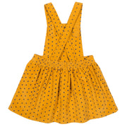 Girl in polka heart pinafore