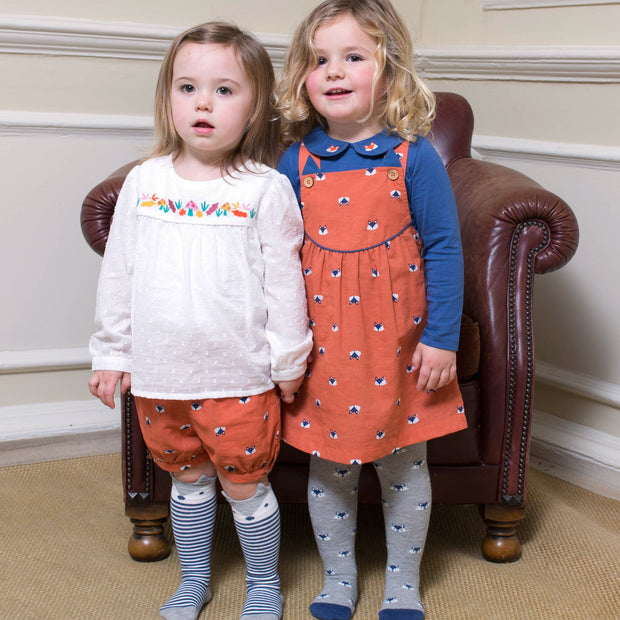 Girl in foxy pinafore set