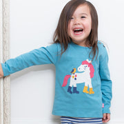 Girl in puddle pony t-shirt