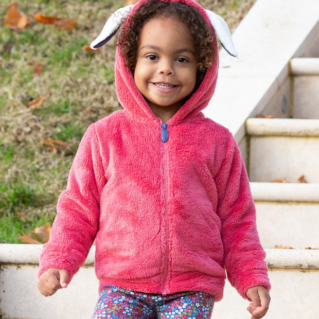 Girl in happy hare fleece pink