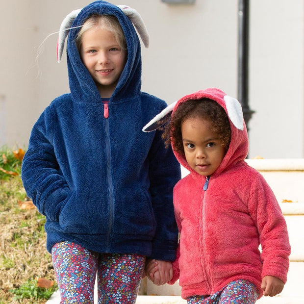 Girl in happy hare fleece pink