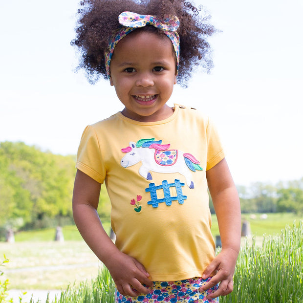 Girl in little pony t-shirt