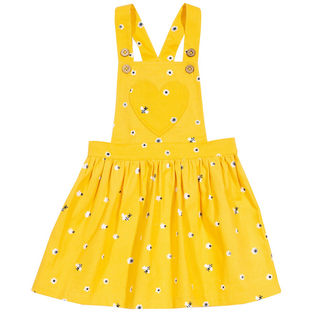 Girl in mini honey bee pinafore