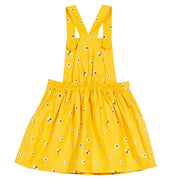 Girl in mini honey bee pinafore